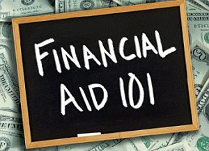 Chalkboard with the words FINANCIAL AID 101 laid on top of a pile of money